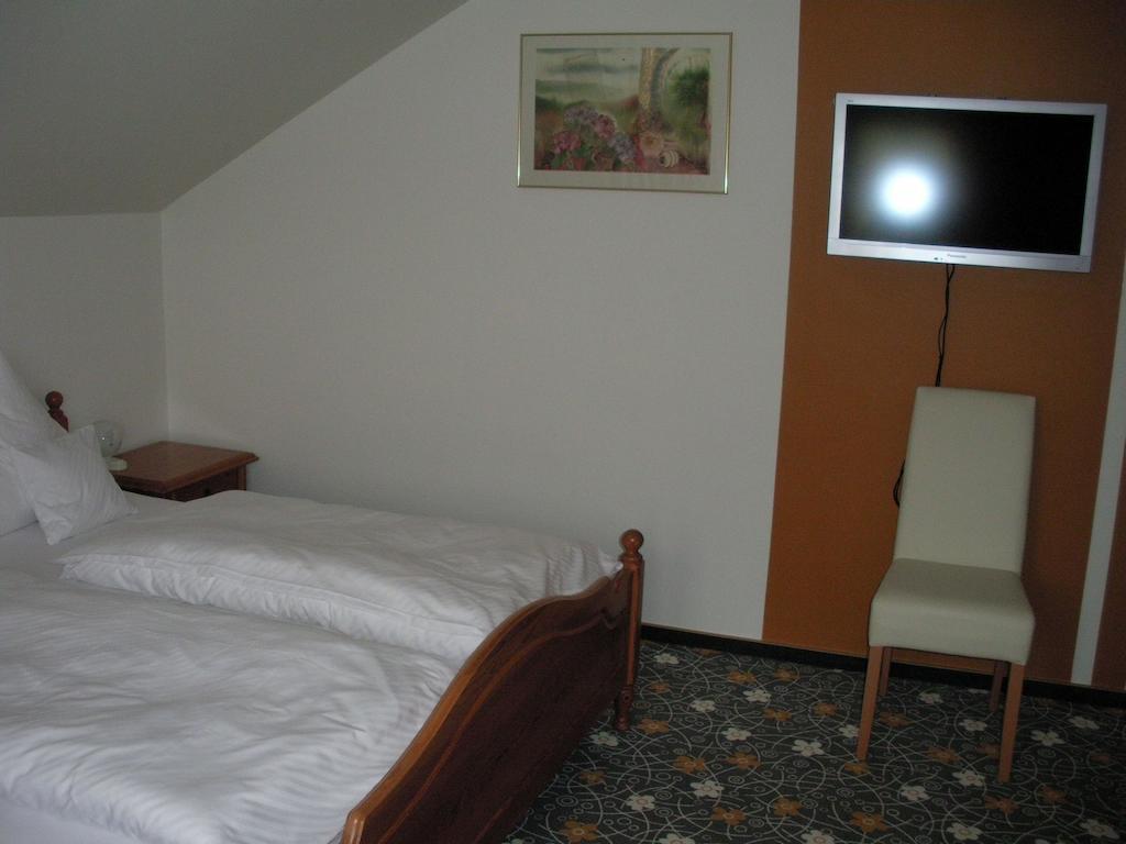 Hotel Company Cölbe Pokoj fotografie
